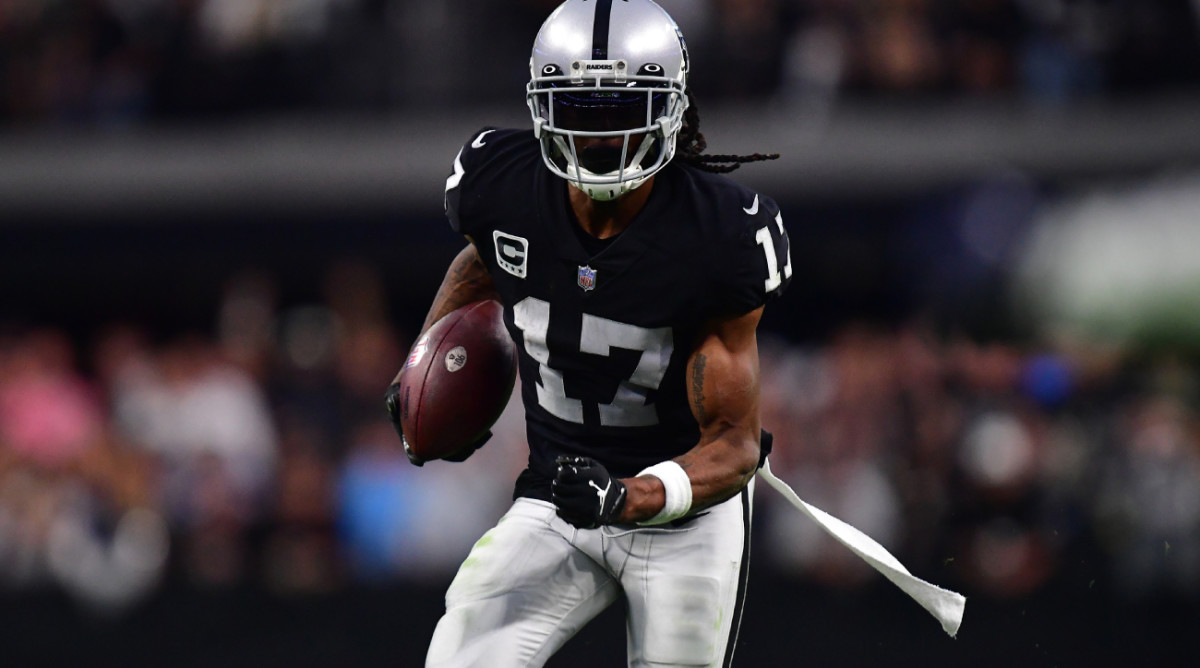 Nov 13, 2022; Paradise, Nevada, USA; Las Vegas Raiders wide receiver Davante Adams (17) runs the ball for a touchdown against the Indianapolis Colts during the second half at Allegiant Stadium. Mandatory Credit: Gary A. Vasquez-USA TODAY Sports  